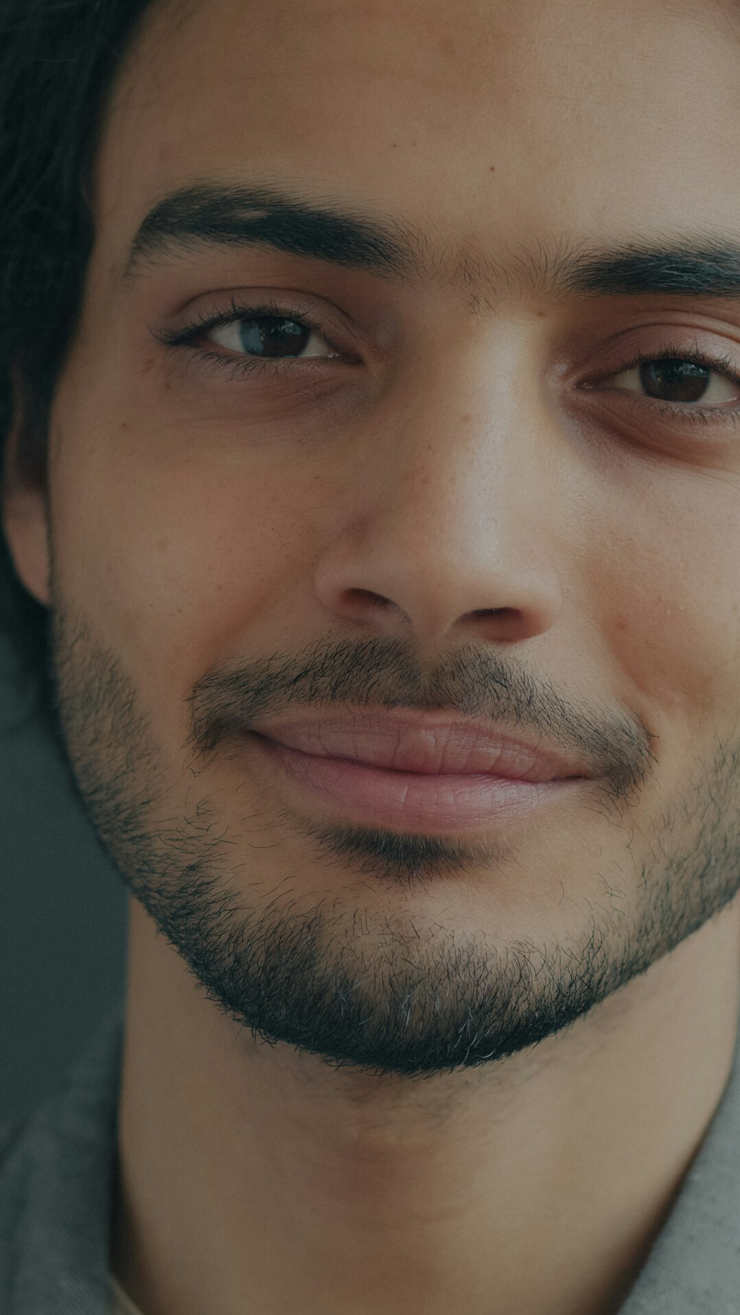 Studio portrait of a slovenian man with short beard smiling