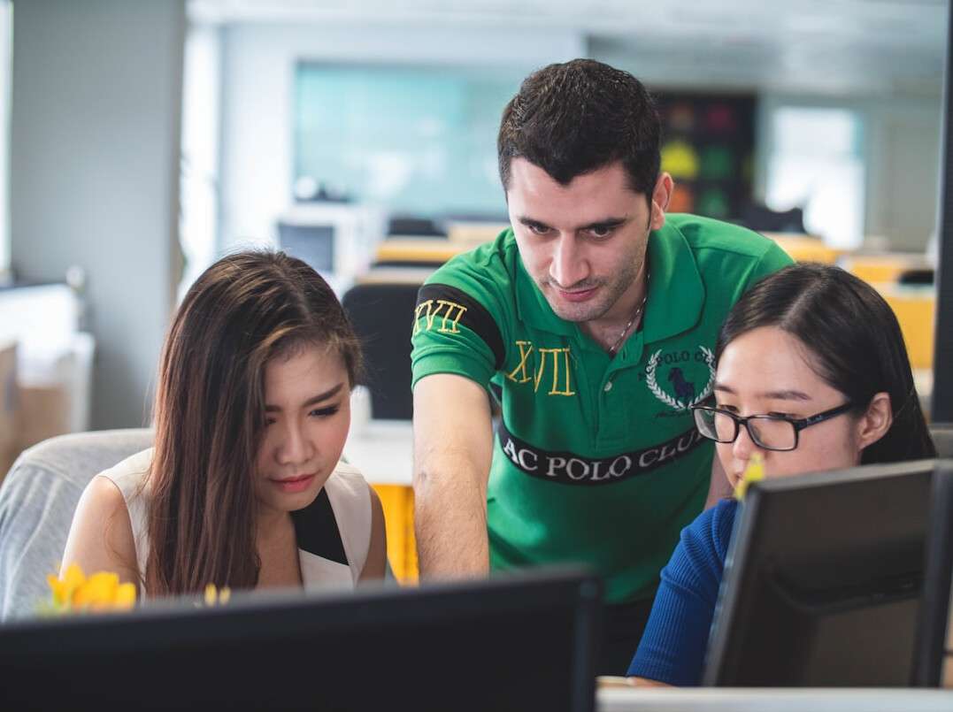 group of students coding together