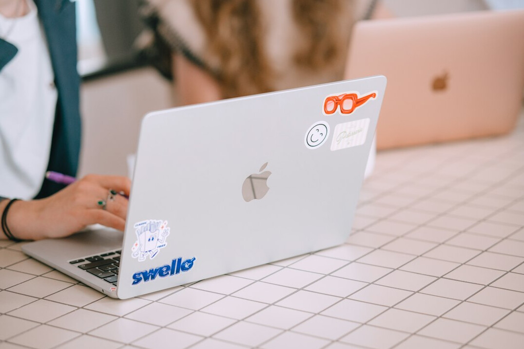 kids coding on laptops