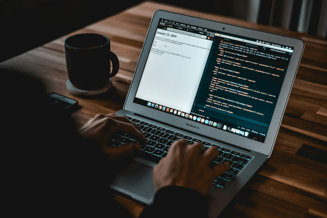 person writing code on screen