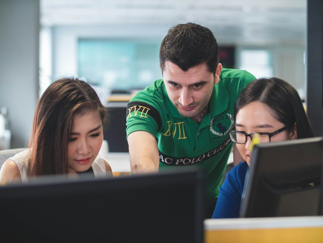 students coding together